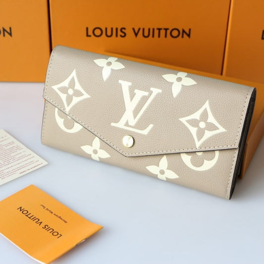 LOUIS VUITTON SARAH WALLET BICOLOR MONOGRAM EMPREINTE TOURTERELLE AND CRÈME 19CM M81049
